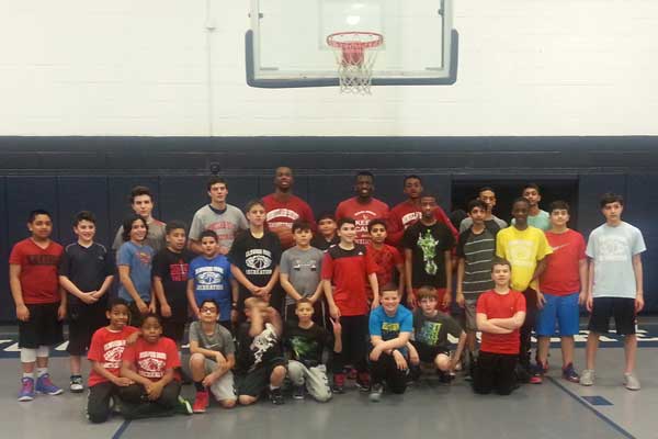 Montclair University basketball players with Elmwood Park Recreation basketball players